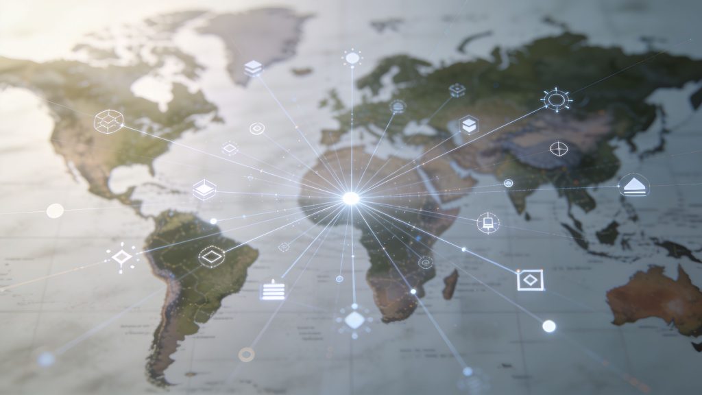 A digital map of the world displaying global connectivity and networking lines radiating from a central point.