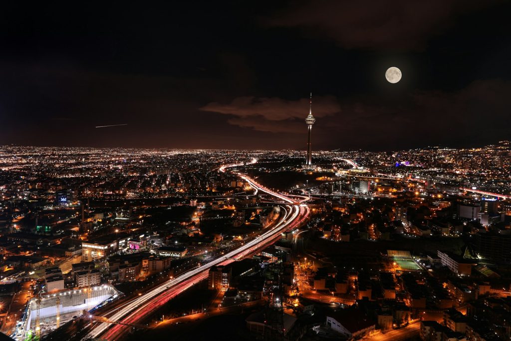Tehran at night as Trump pauses a planned strike and gives diplomacy another window. Photo by Kamran Gholami on Unsplash.